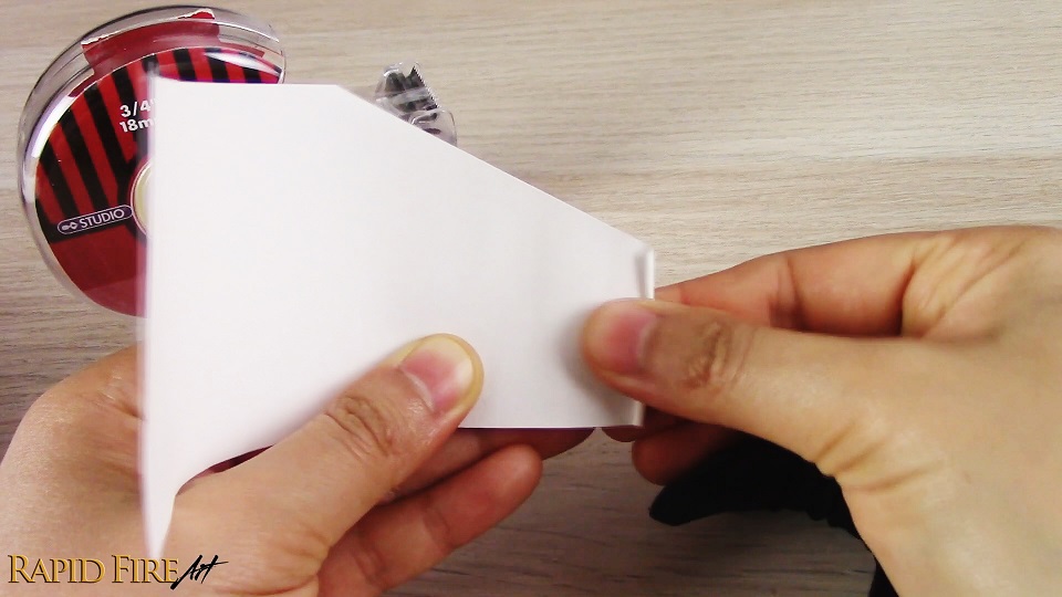 rolling a piece of paper to make a blending stump