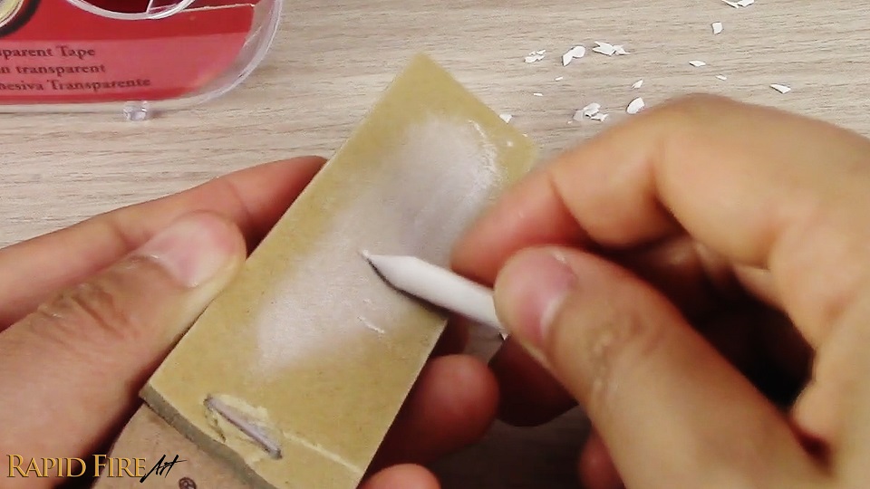 smoothing out a blending stump tip using sandpaper